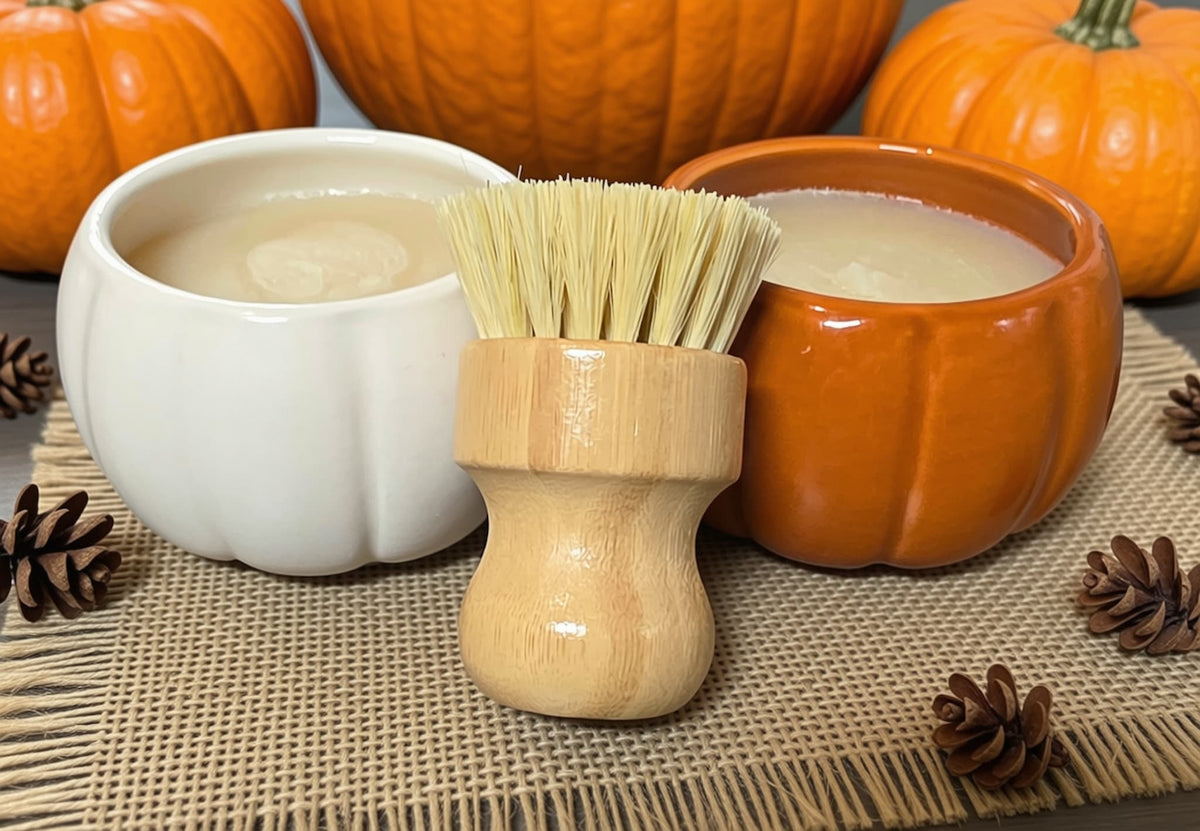 white and orange pumpkin ramekin with bamboo brush