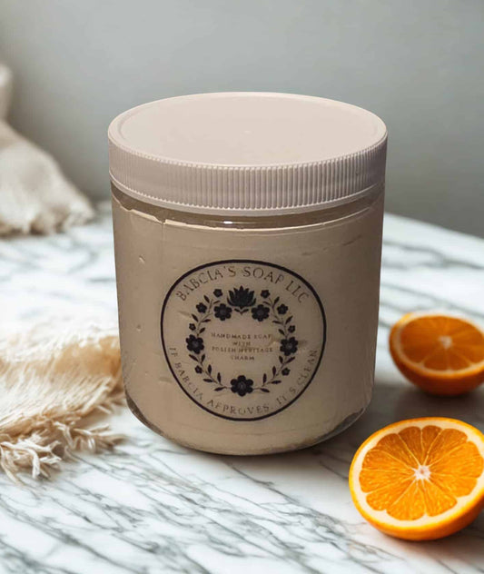 Jar of whipped sugar scrub in orange