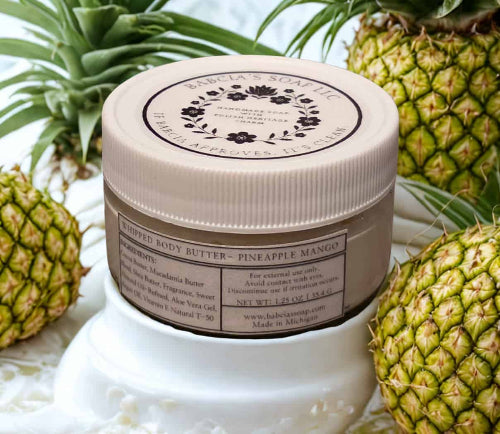 Jar of whipped body butter with pineapple mango scent
